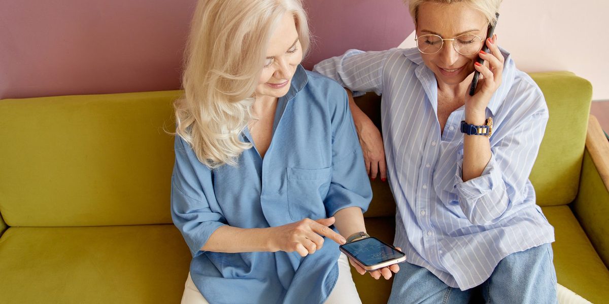 Two patients using the practice app on a phone at home.