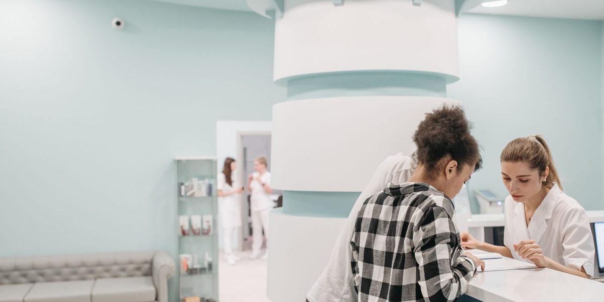 The reception and waiting area of a busy chiropractic clinic.
