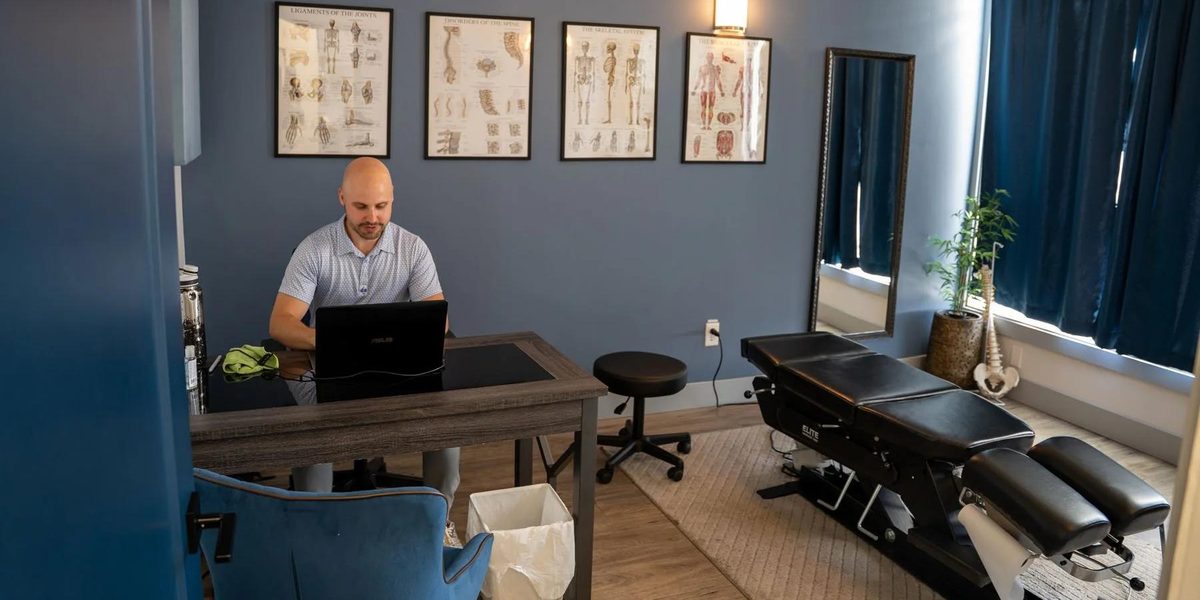 A modern chiropractic treatment room prepared for the day.