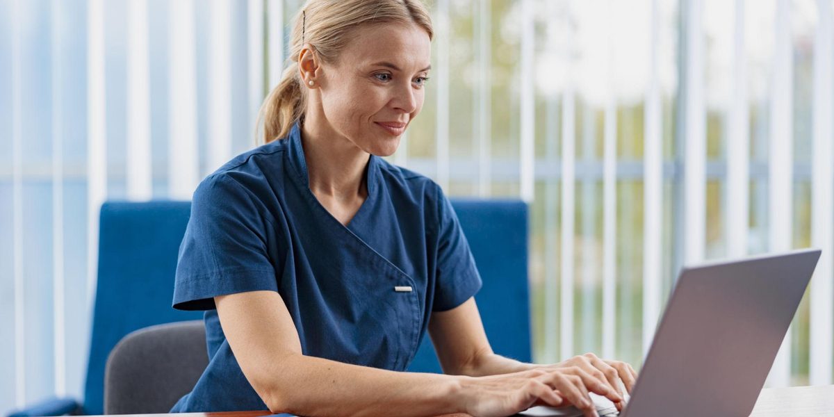 A clinician catching up on charts between patients.