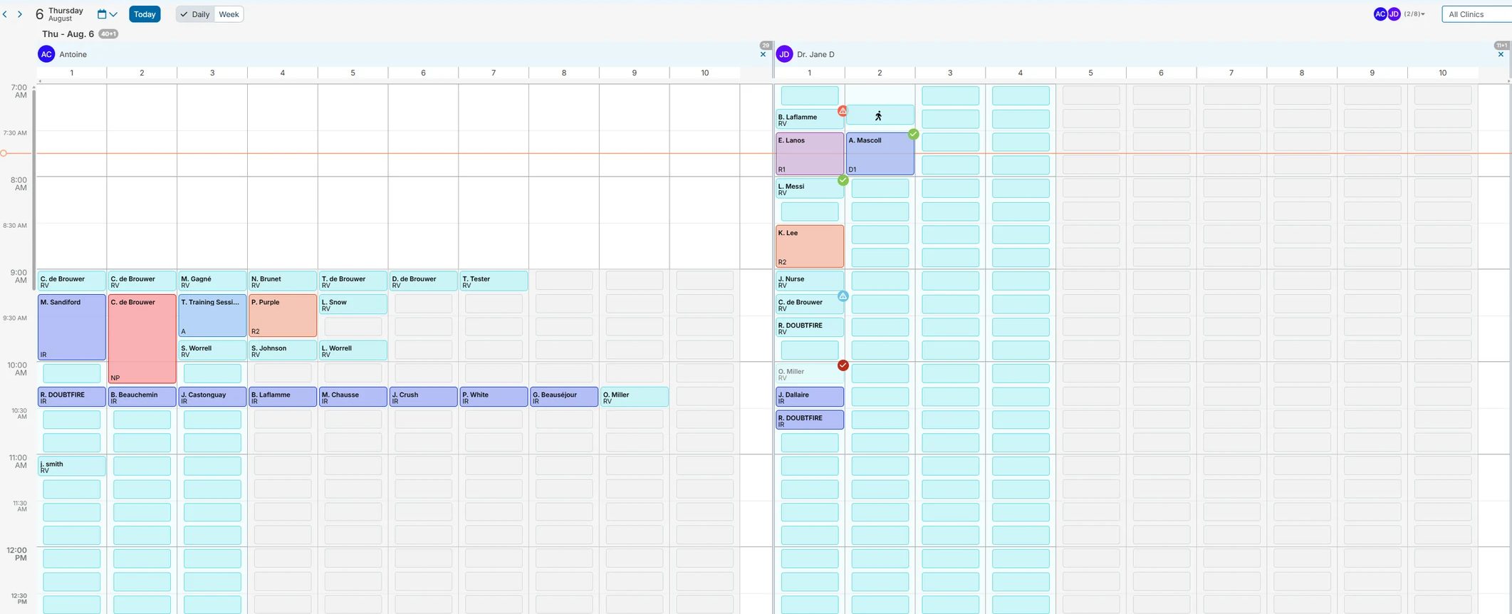 The Platinum schedule in day view — two provider columns with room lanes, colour-coded appointments, check-in and confirmation states, and the current-time line running across the morning.